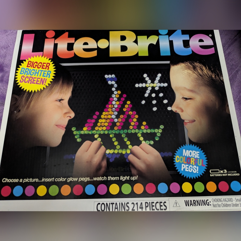 Lite Brite Toy With Some Colored Pegs See Photo
